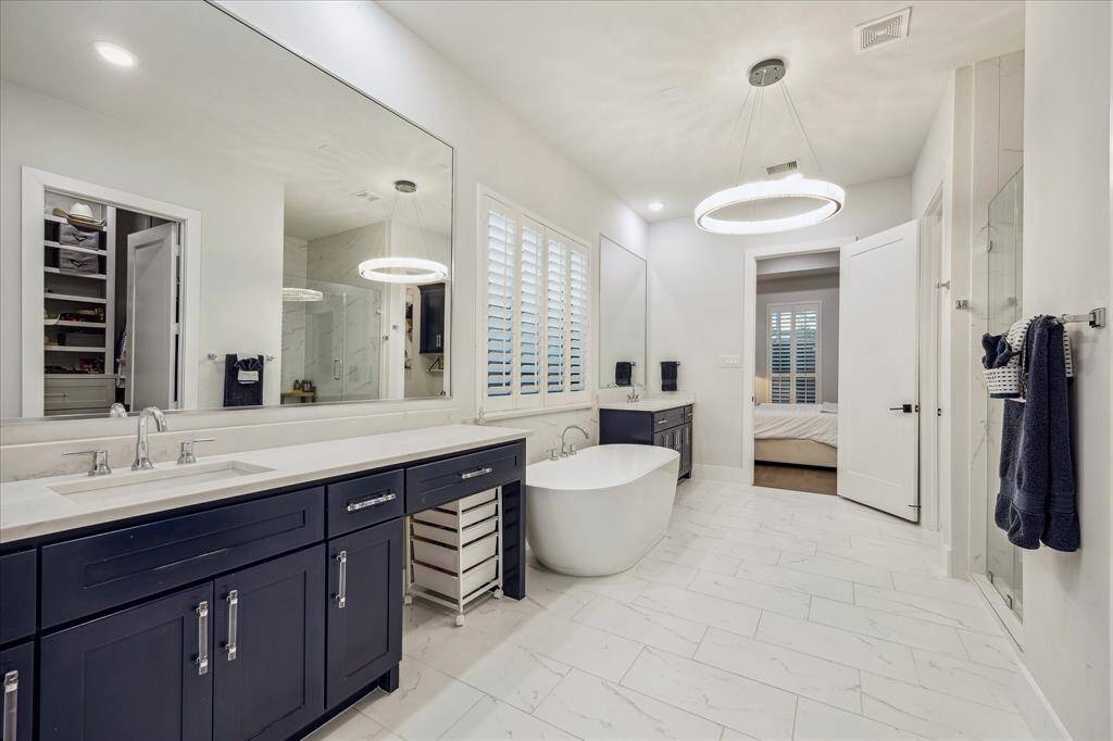 You'll find a first floor primary retreat. Engineered hardwoods continued, tray ceilings, plantation shutters and more.