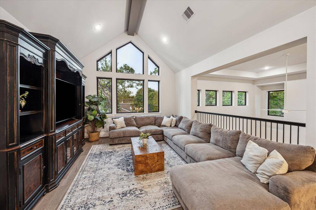 Make your way up stunning spiral staircase to gameroom and three additional beds.