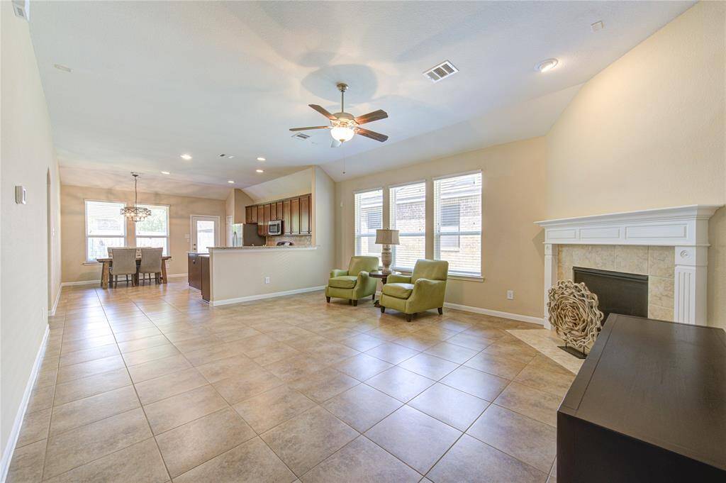 Look at this glorious space! Easy to maintain tile floor throughout the main area. Large living room, open to the kitchen. So spacious!