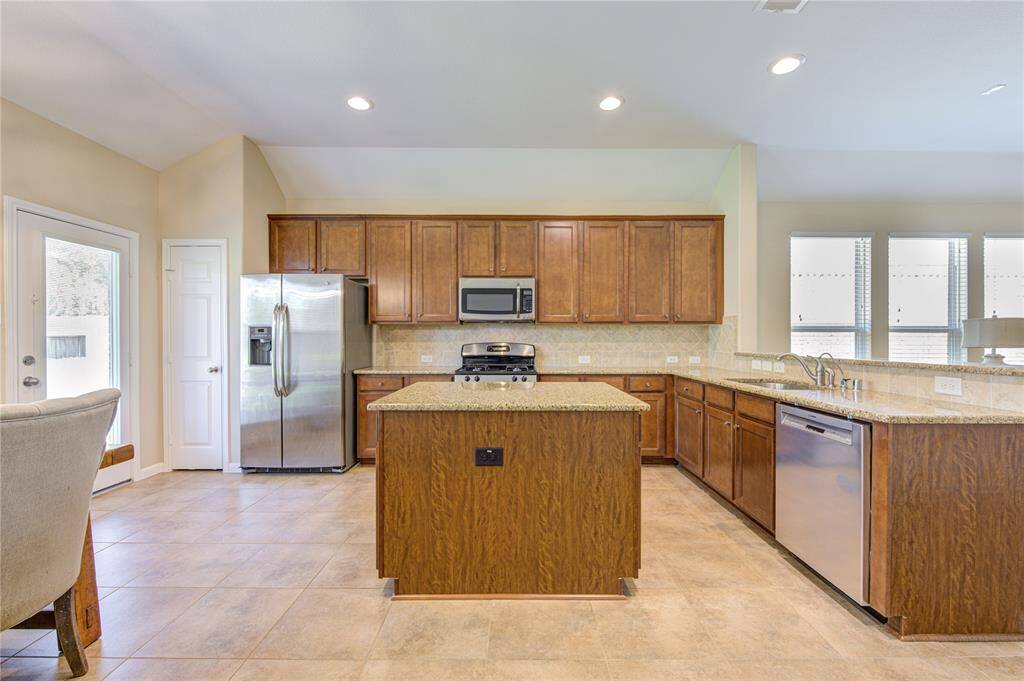 Timeless cabinetry and granite counters. Refrigerator stays with the house!