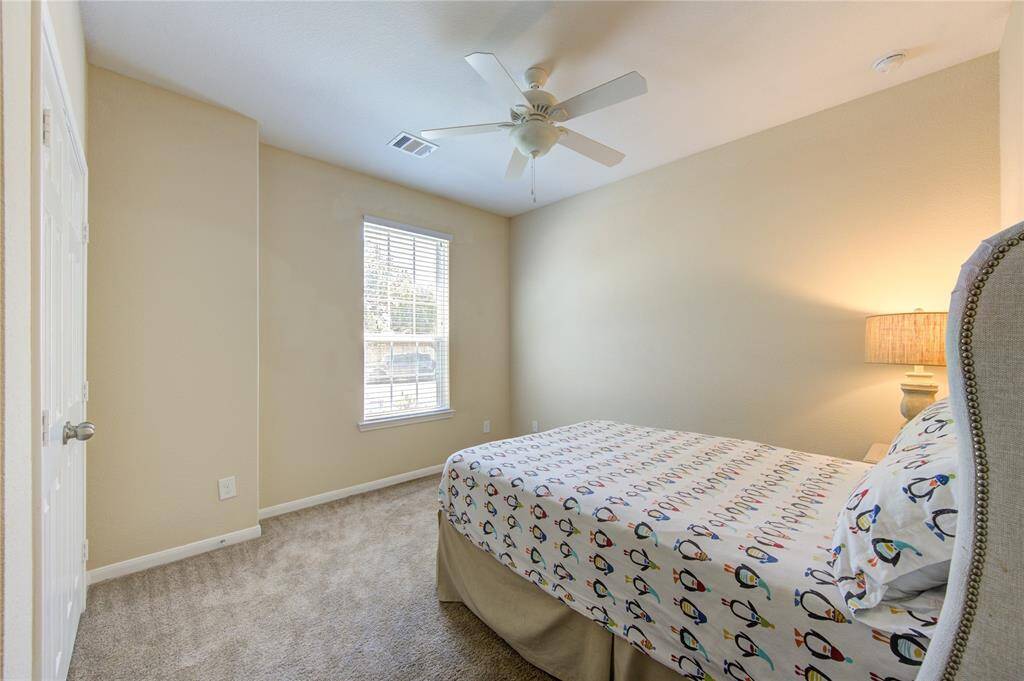 Secondary bedroom, this one is located in the front of the house and could make a perfect office, too.