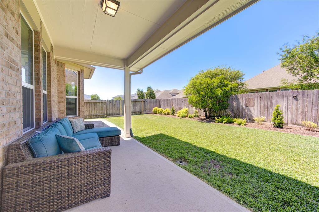 Outside, you will find oversized, covered patio, that's been extended on both sides.