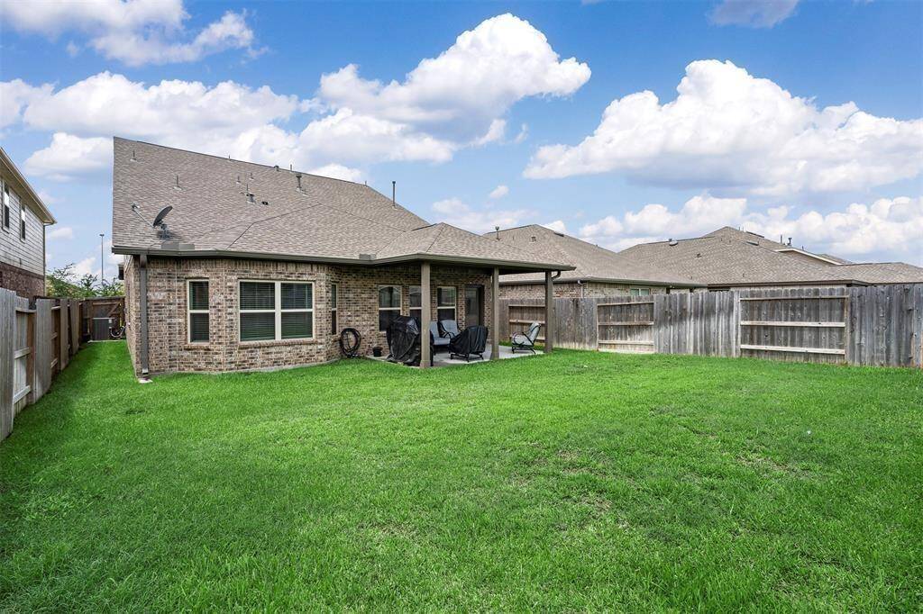 Large Backyard with a covered patio.