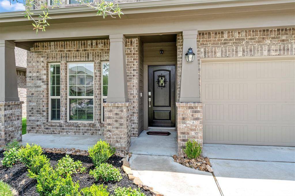 Inviting porch with a beautiful earth toned elevation.
