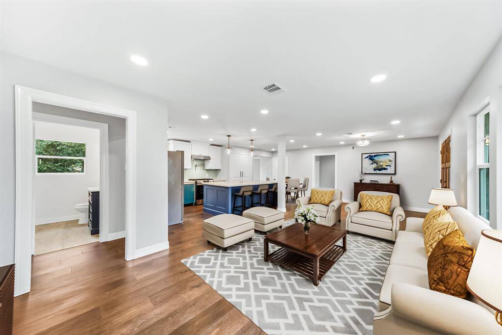Virtually Staged: Stunning open floor plan with easy access to the living, dining, and kitchen areas.