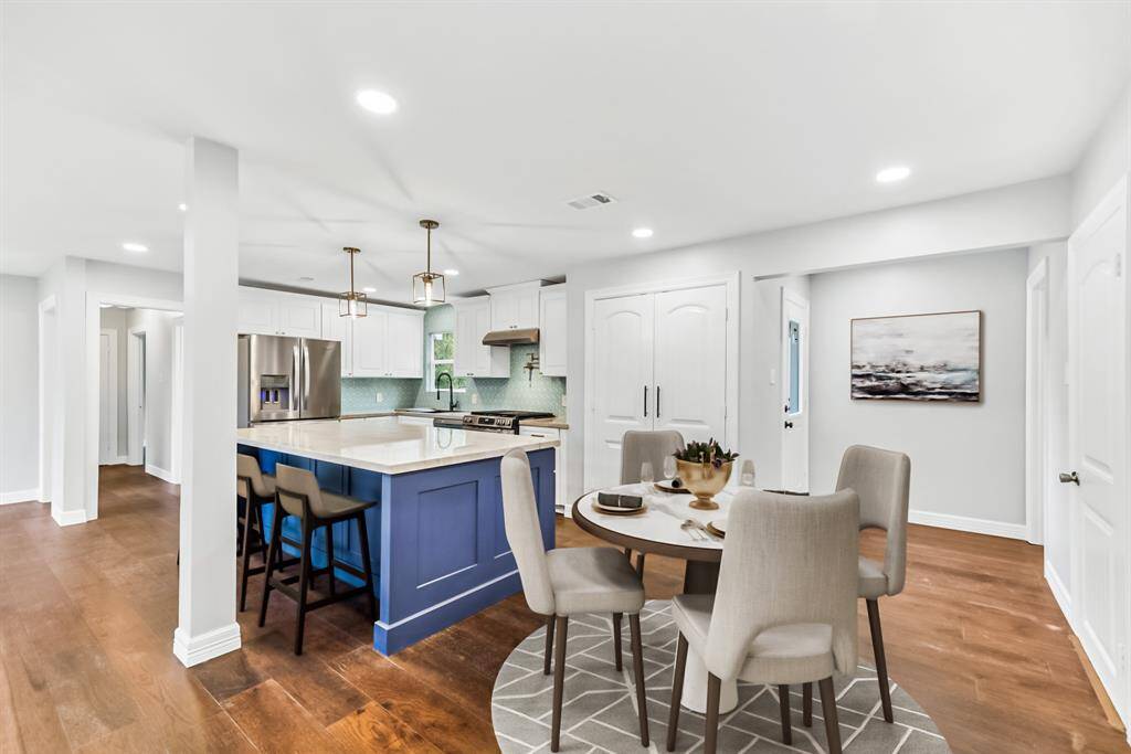 Virtually Staged: Stunning open floor plan with easy access to the living, dining, and kitchen areas.