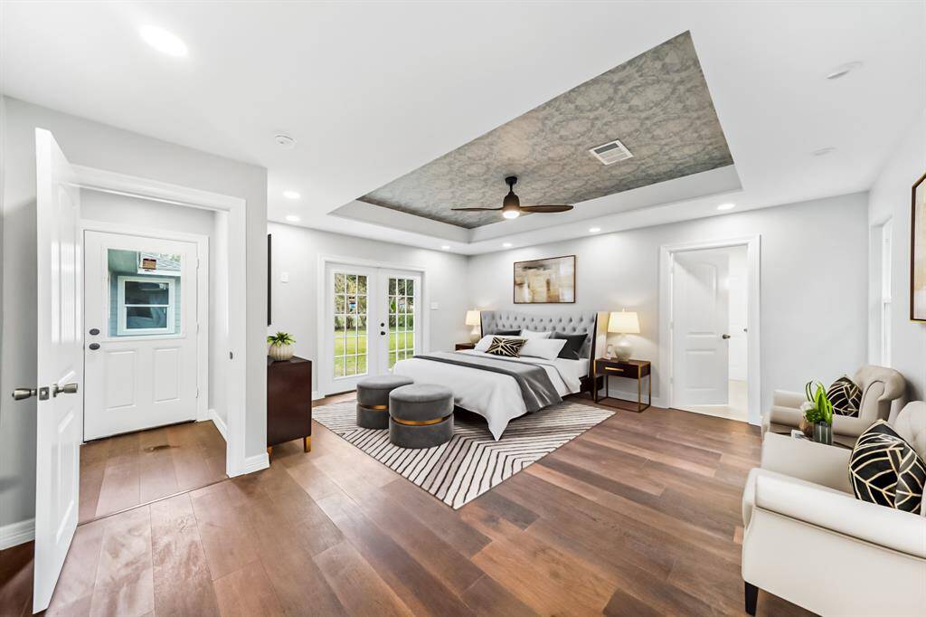 Virtually Staged: Unwind after a long day in this incredile Primary Bedroom! Featuring lots of natural light and recessed lighting, engineered wood floors, and an en-suite bathroom.