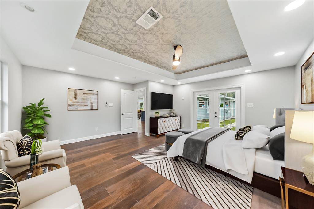 Virtually Staged: The tray ceiling has beautiful details, and a double glass door that will grant immediate access to the backyard.