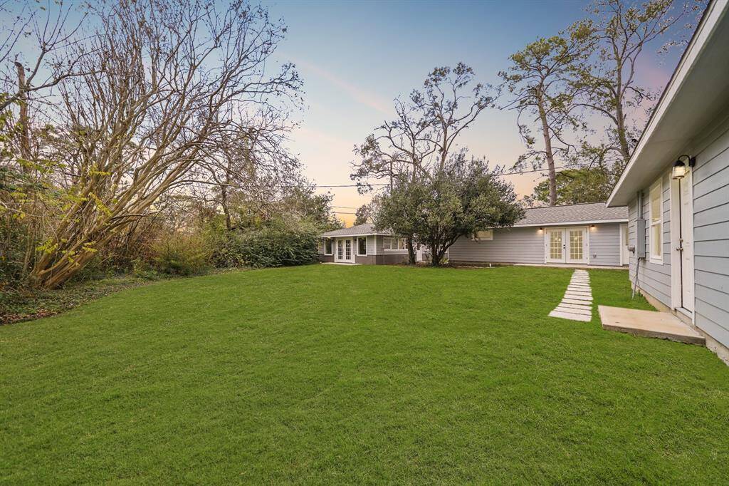 This HUGE backyard is definitely not lacking on green space!