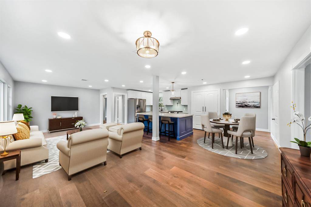 Virtually Staged: Stunning open floor plan with easy access to the living, dining, and kitchen areas.