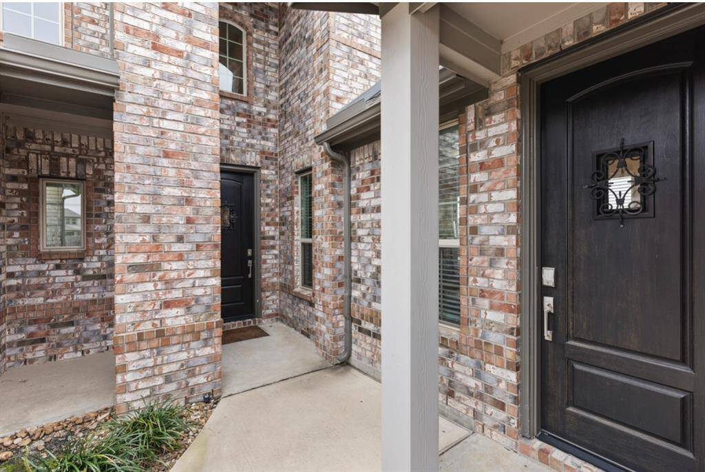 The door to the right provides a private exterior entrance to the guest suite, offering convenience and added privacy.