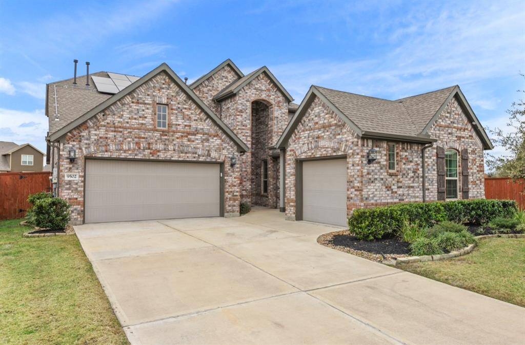 There are a total of three garage spaces, with the right-side garage offering direct access to the in-law suite, which can also serve as a private apartment