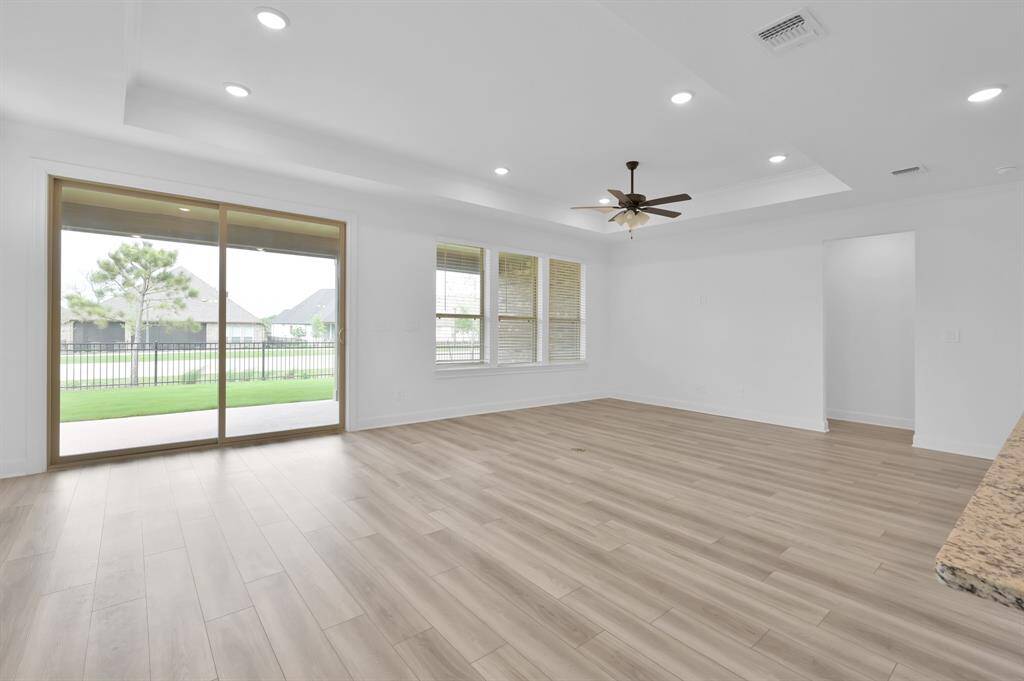 Sliding back doors leading you onto the covered patio