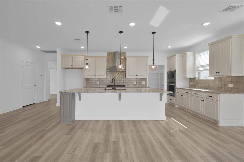 Great kitchen with granite countertops and custom cabinets with tons of storage!