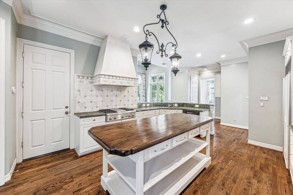 Here's another perspective of this incredible kitchen, highlighting its convenient access to the attached garage and utility room.
