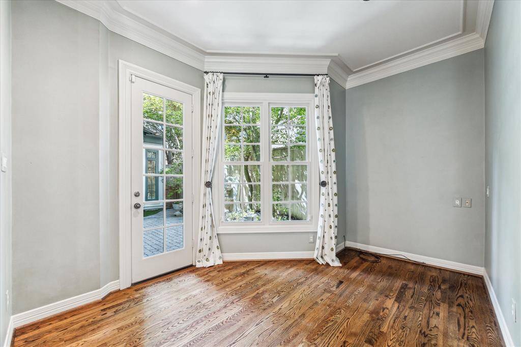 The charming breakfast nook is perfectly situated within the kitchen and opens directly to the outdoor patio, creating a seamless blend of indoor and outdoor dining experiences.