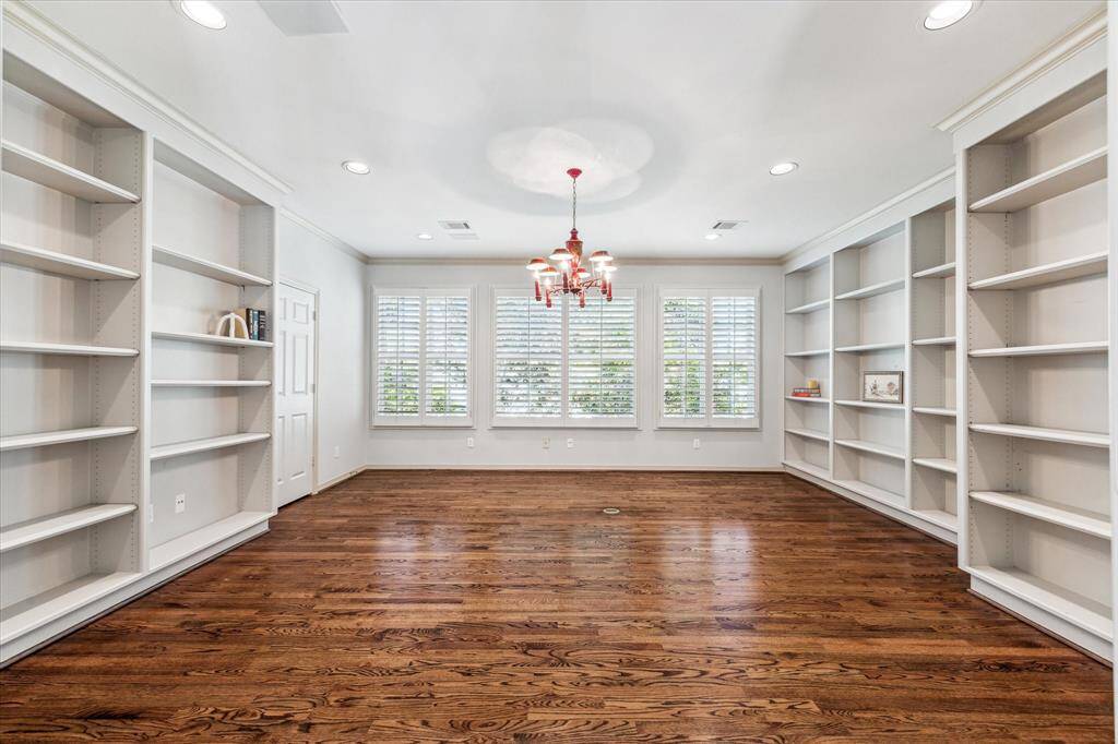 The previous sellers used this space as as study, but can also be a bedroom with it's double entry doors, closet and incredible shelving to display your most prized possessions.