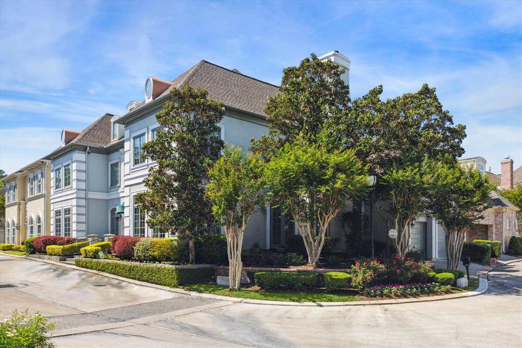 The charming side yard, partially owned and maintained by the HOA, offers both privacy and tranquility.