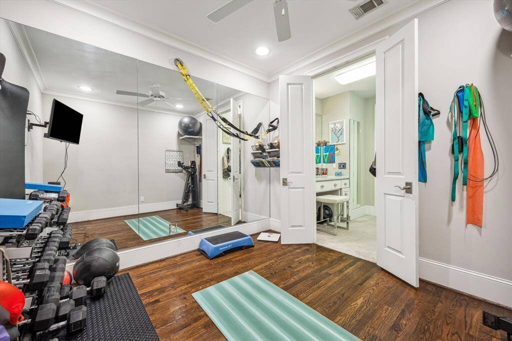 Through the primary closet, discover the attached 10x10 exercise room with elegant hardwood floors and expansive mirrors—an ideal space for fitness enthusiasts!