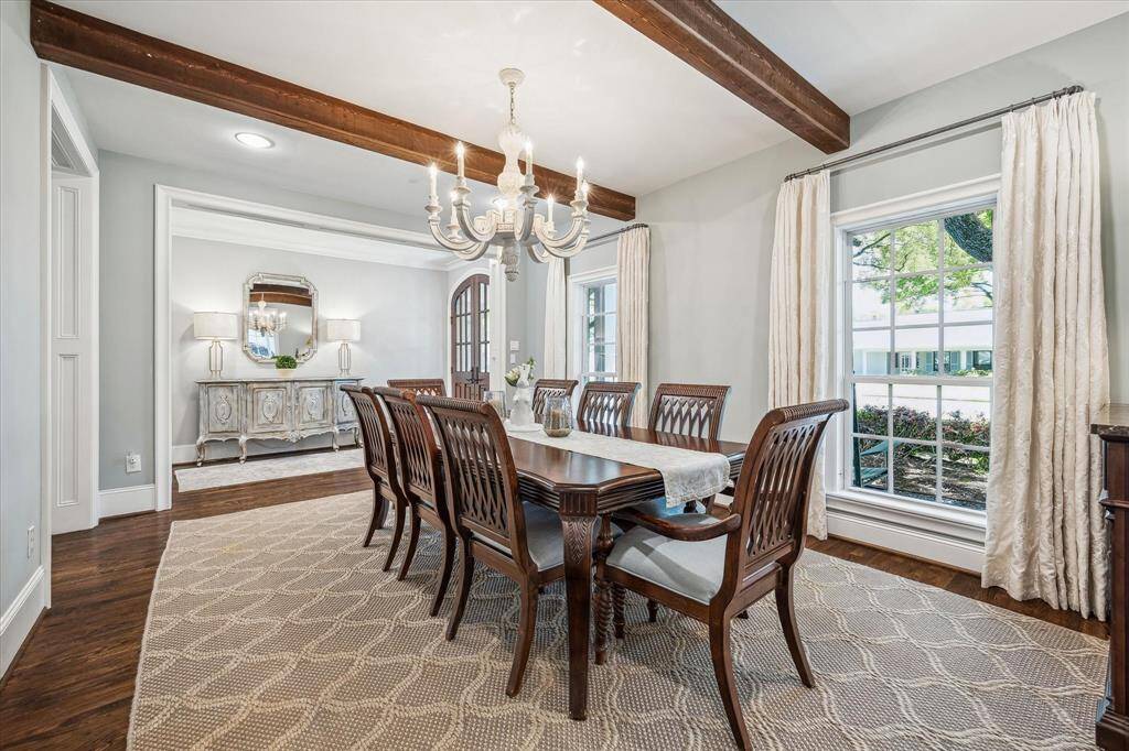Experience timeless elegance with original hardwood floors, exquisite millwork, expansive windows, and a thoughtfully designed layout.
