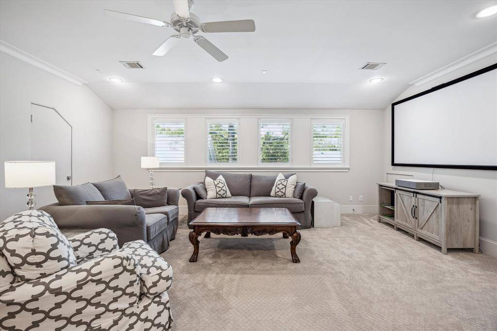 Discover the inviting game room upstairs, featuring plantation shutters, recessed lighting, 9-foot ceilings, and a spacious closet—perfect for relaxation and fun.