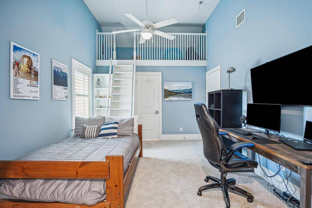 Explore this inviting loft, perfect for creating lasting memories. The door ahead opens to an en-suite bathroom, while the door to the right leads to an exciting game room.