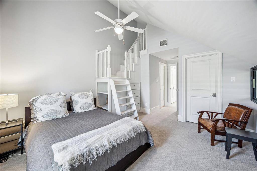 Another bedroom featuring a unique loft that seamlessly connects to the adjacent room.