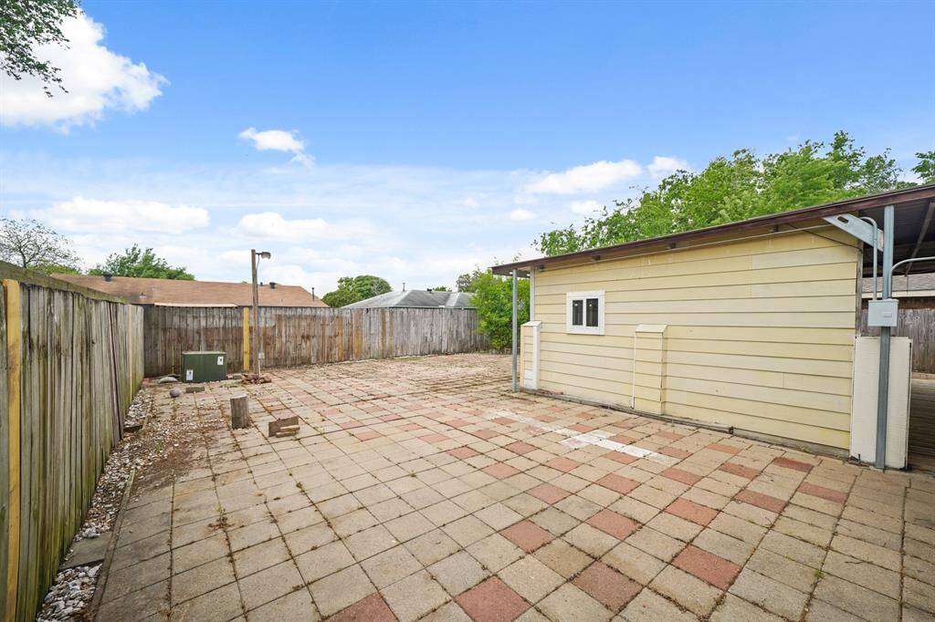 The backyard is tiled, offering a low-maintenance space perfect for outdoor gatherings, relaxation, or play. Its large layout provides plenty of room for various activities.