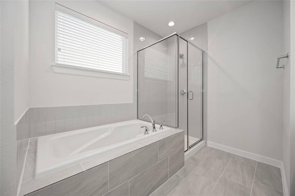 Tub and Stand Up Shower in Primary Bathroom