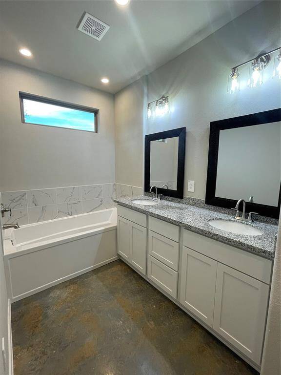 Primary Bathroom with Dual Vanity Sinks & Soaker Tub