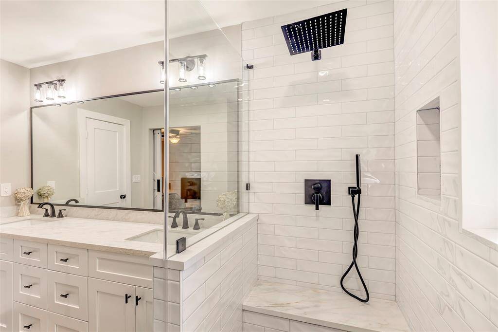 Double sided primary shower - this one with rain shower head, built in seat and hand held shower as well.