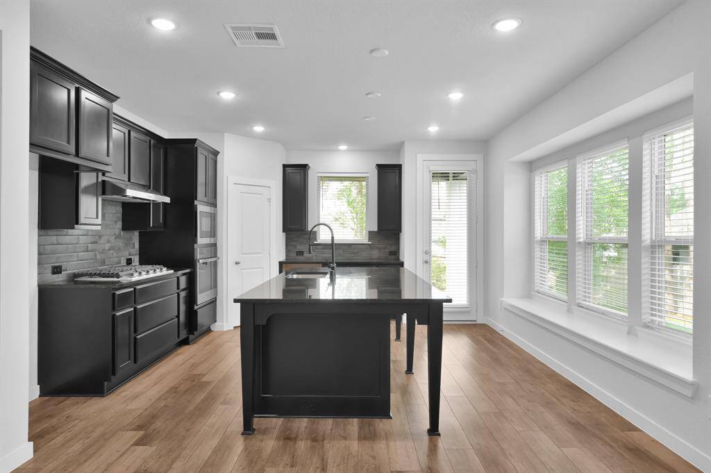High-end finishes and functionality come together in this stylish and spacious kitchen.