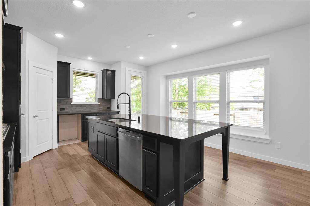 Elegant kitchen space with backyard views and an open feel.