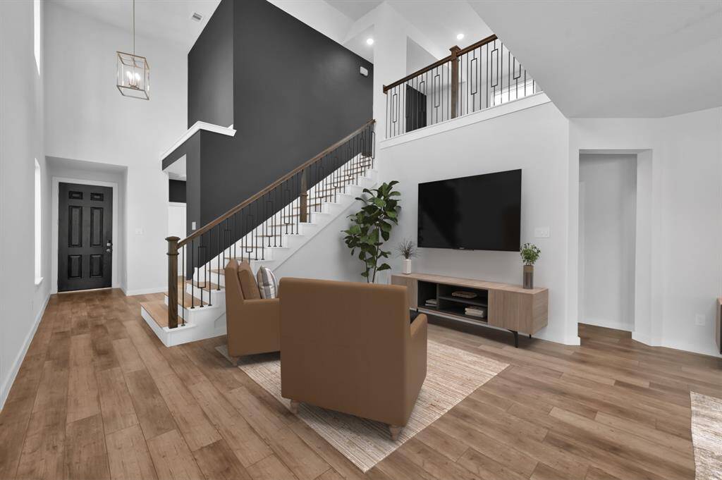 The potential for this living space is limitless. With floor to ceiling windows, this room is bathed in natural sunlight. Virtually staged.