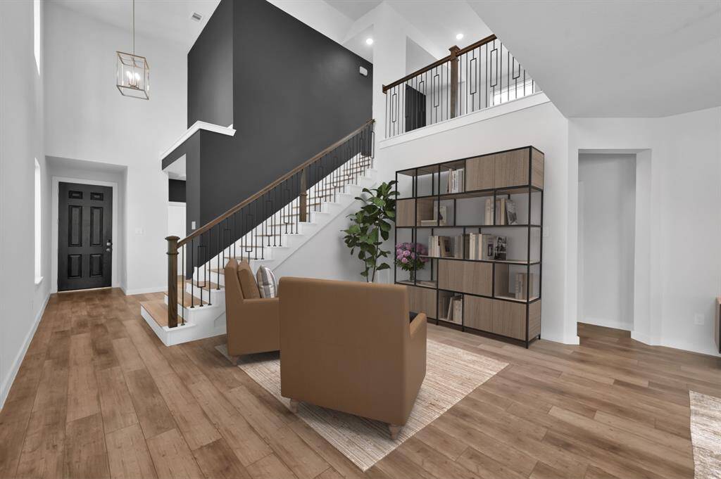 Prefer pages over pixels? This alternate setup offers a warm and welcoming home library feel. Virtually staged.