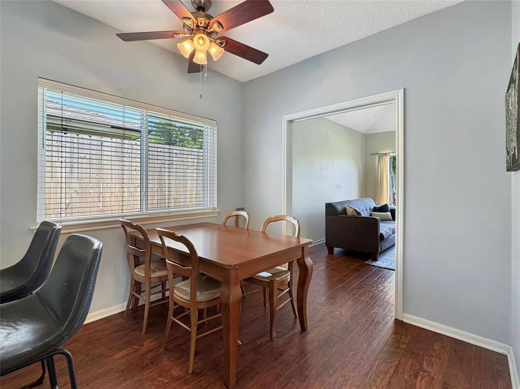 View of breakfast room from kitchen, overlooking  living room.