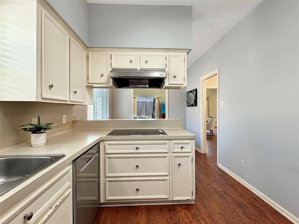 View of kitchen into breakfast room and living room
