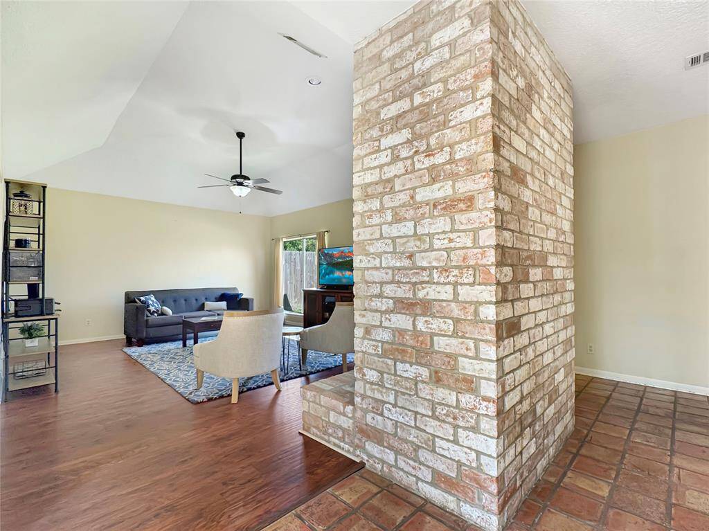 High ceilings welcome you to the open living room.