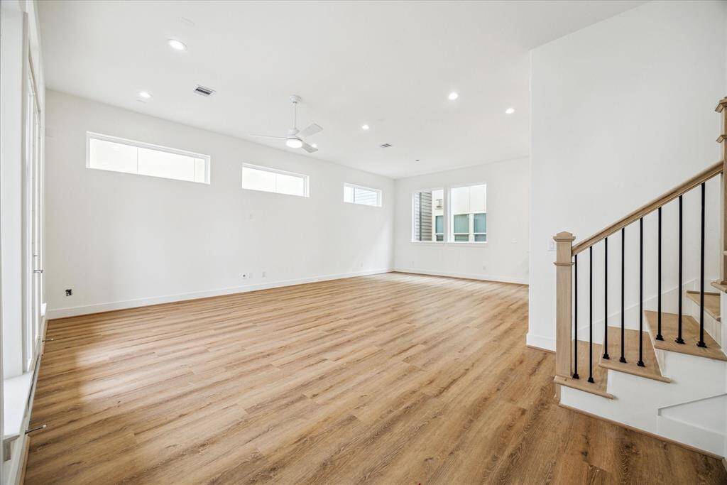A view back through your living room toward your kitchen and dining area