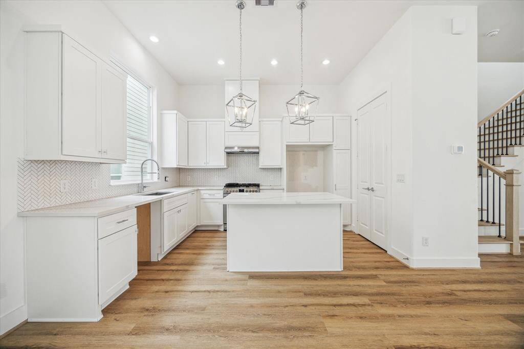 Modern kitchen with designer finishes *all cabinet have been upgraded to shaker style