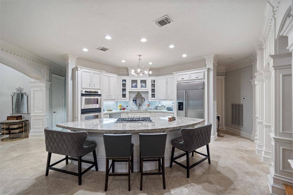 LOVELY DOUBLE OVENNED KITCHEN WITH ALL THE HIGH END STAINLESS APPLIANCES