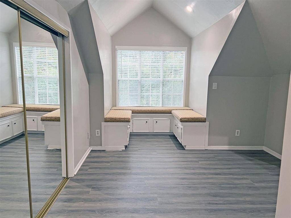 3rd floor bedroom with window seating and storage