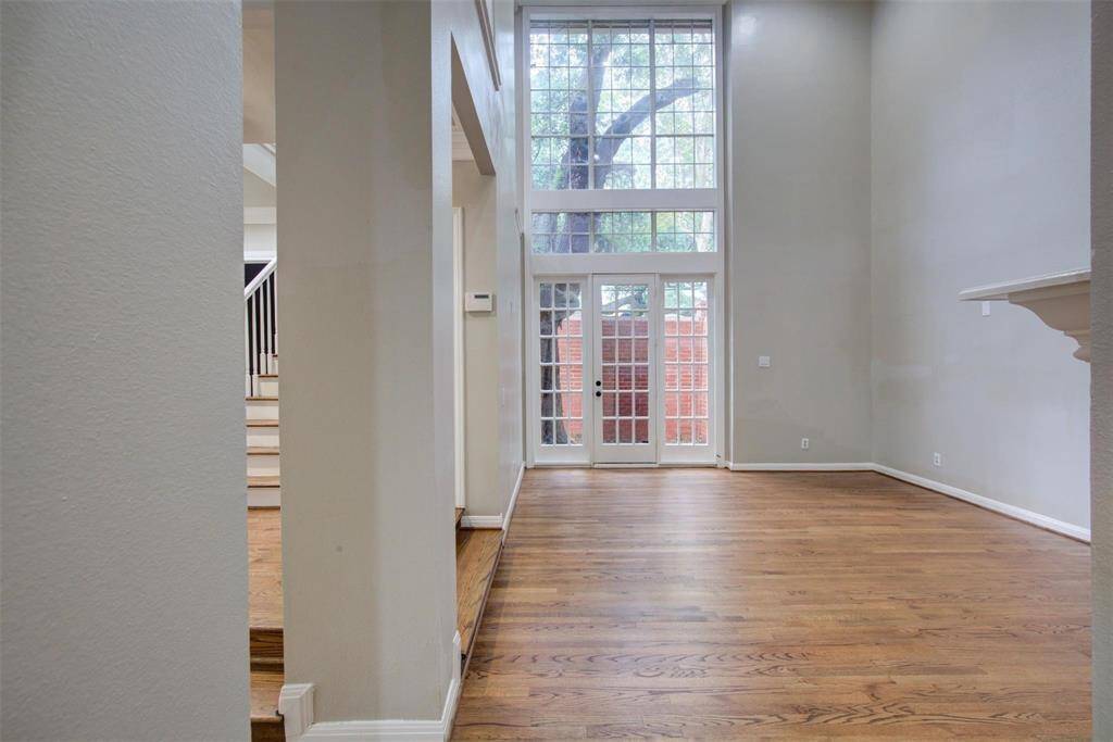Living room with 2 story high ceilings
