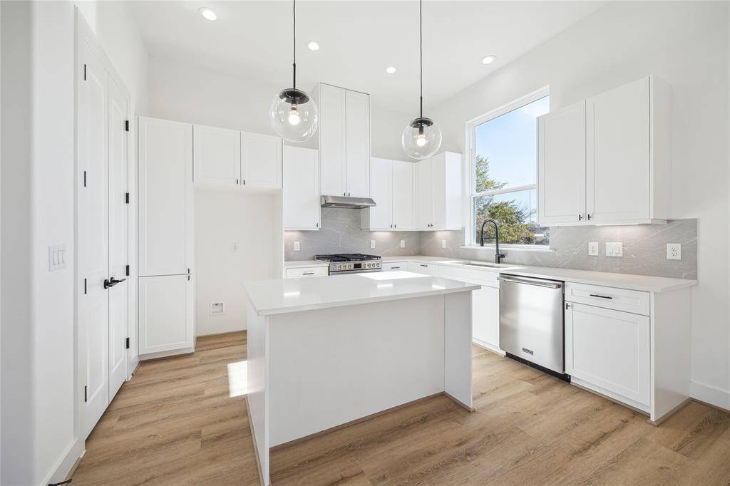 Soft close shaker style cabinets, designer tile back splash and quartz counter tops through out your kitchen