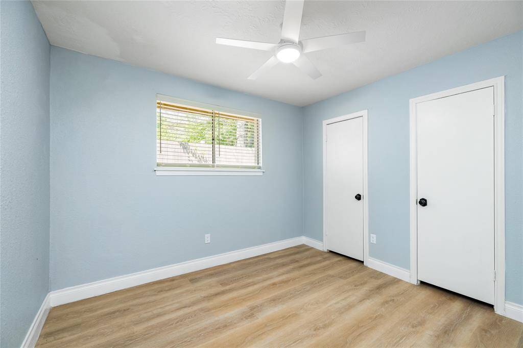 The second of the four bedrooms found downstairs.