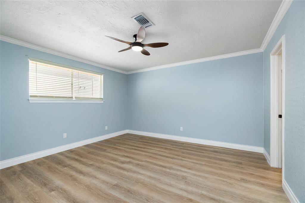This is the fourth of the four bedrooms found downstairs. This bedroom has its own bathroom suite and walk in closet. You can choose to make it your master suite or use as a mother-in-law suite.