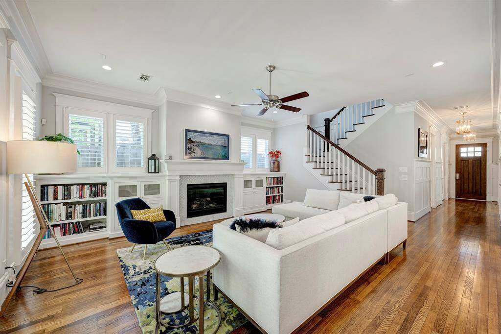 View of the family room looking towards the front door. Stairs lead to the 2nd story of the home.