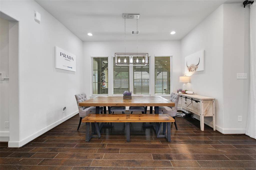 Living room is spacious and provides access to both yards.