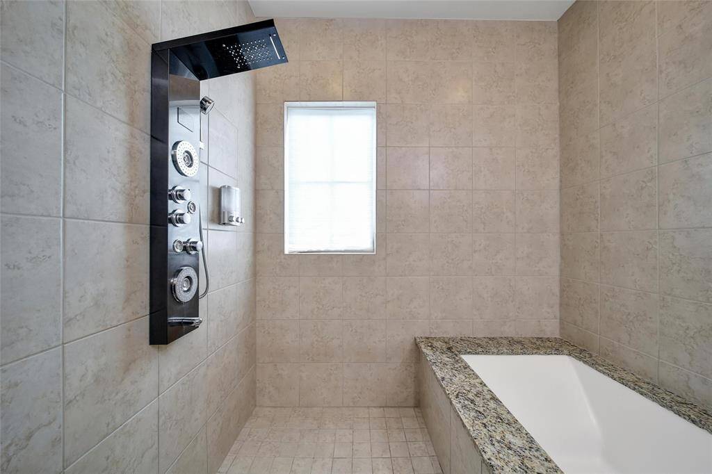 Mud room off garage allows space for refrigerator.