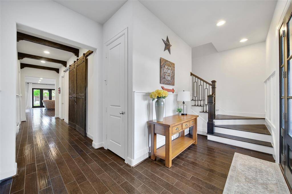 The entry allows the option to go upstairs, or enter the main living area downstairs.
